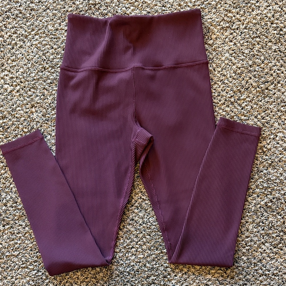 Athleta brand Women’s ribbed tight. Size small. Color is spiced cabaret.